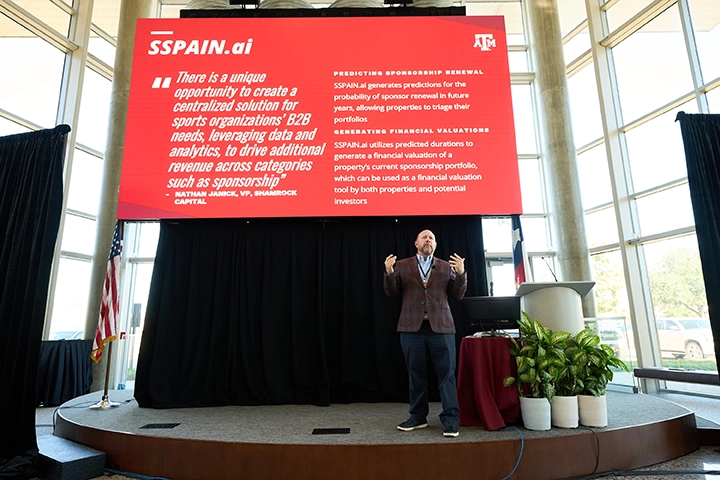 Dr. Jonathan Jensen speaks at a conference.
