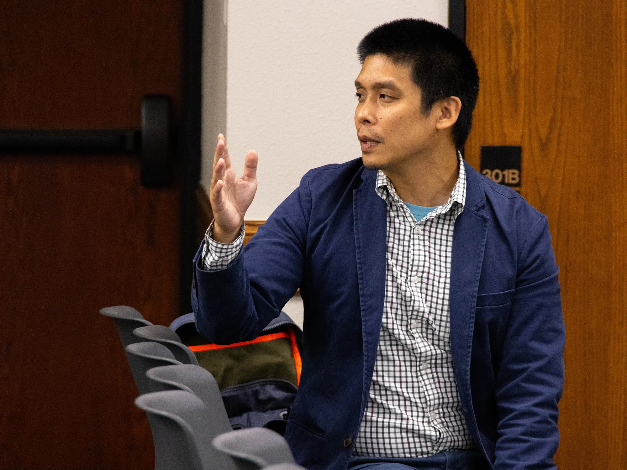 Dr. Andrew Kwok speaks during a lecture