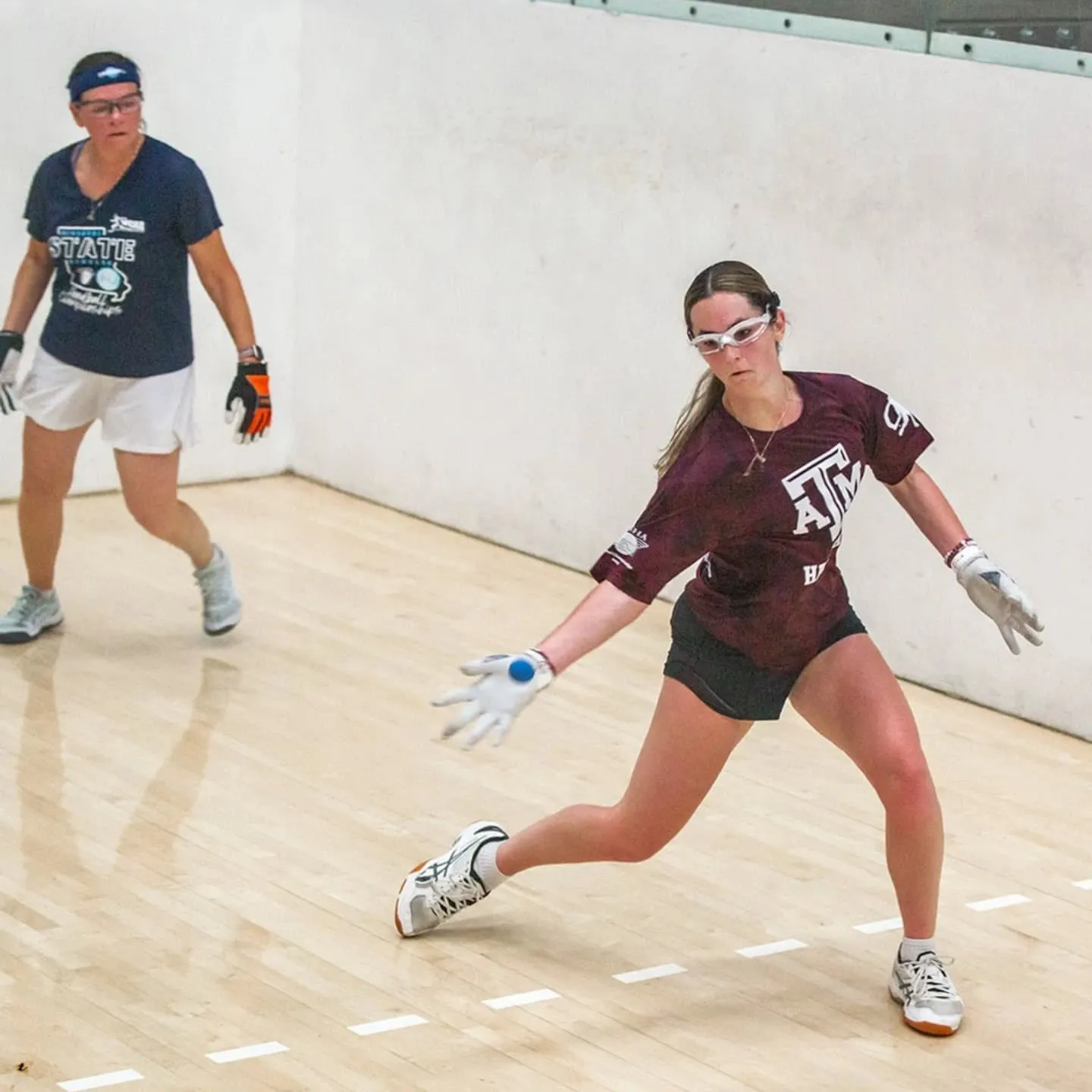 Two women playing handball.